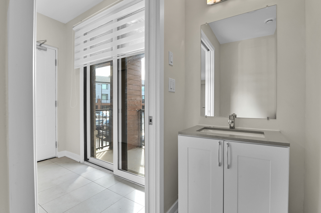 Modern bathroom sink and vanity in a 2-bedroom townhouse in Stittsville.