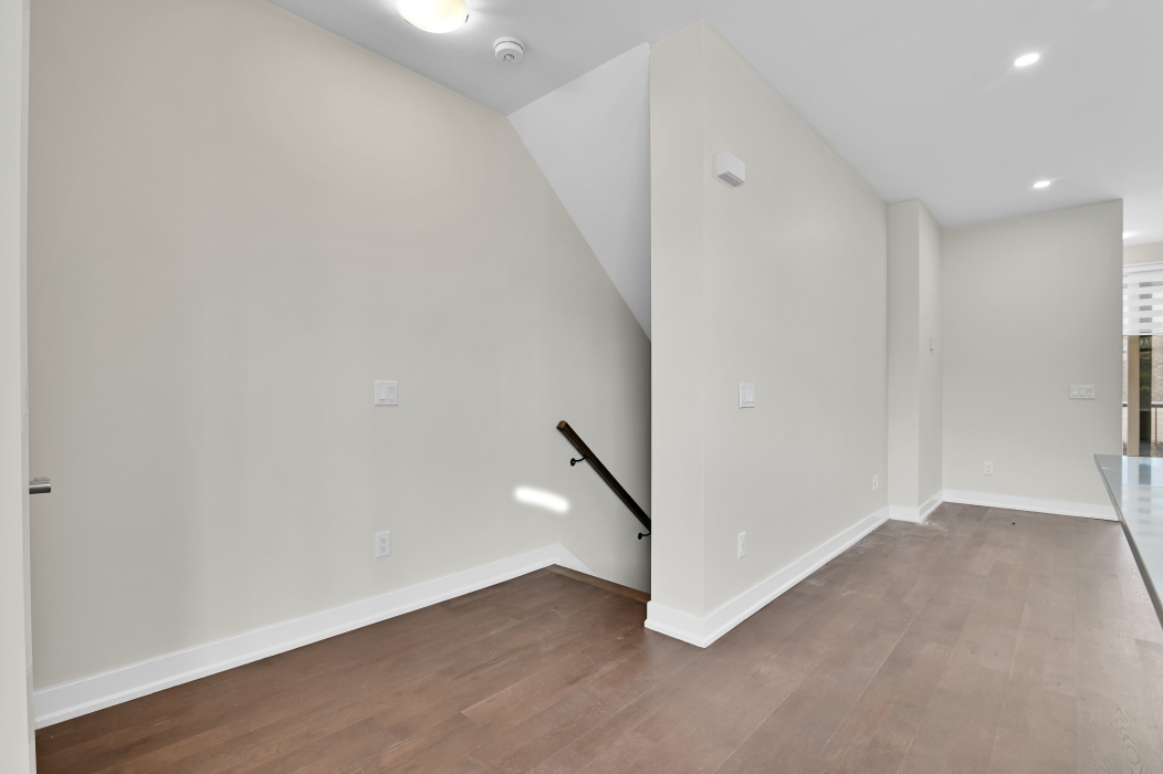 Stairs leading down to the basement of a 2-bedroom townhouse in Kanata.