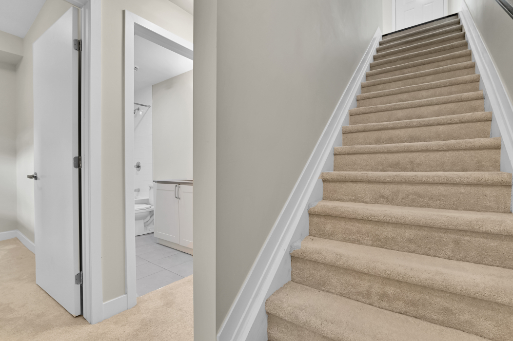 Interior view of stairs descending to the basement level of a 2-bedroom Ottawa townhouse.