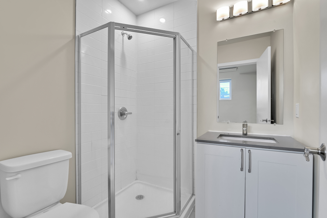 Modern ensuite bathroom attached to the master bedroom of a 2-bedroom townhouse.