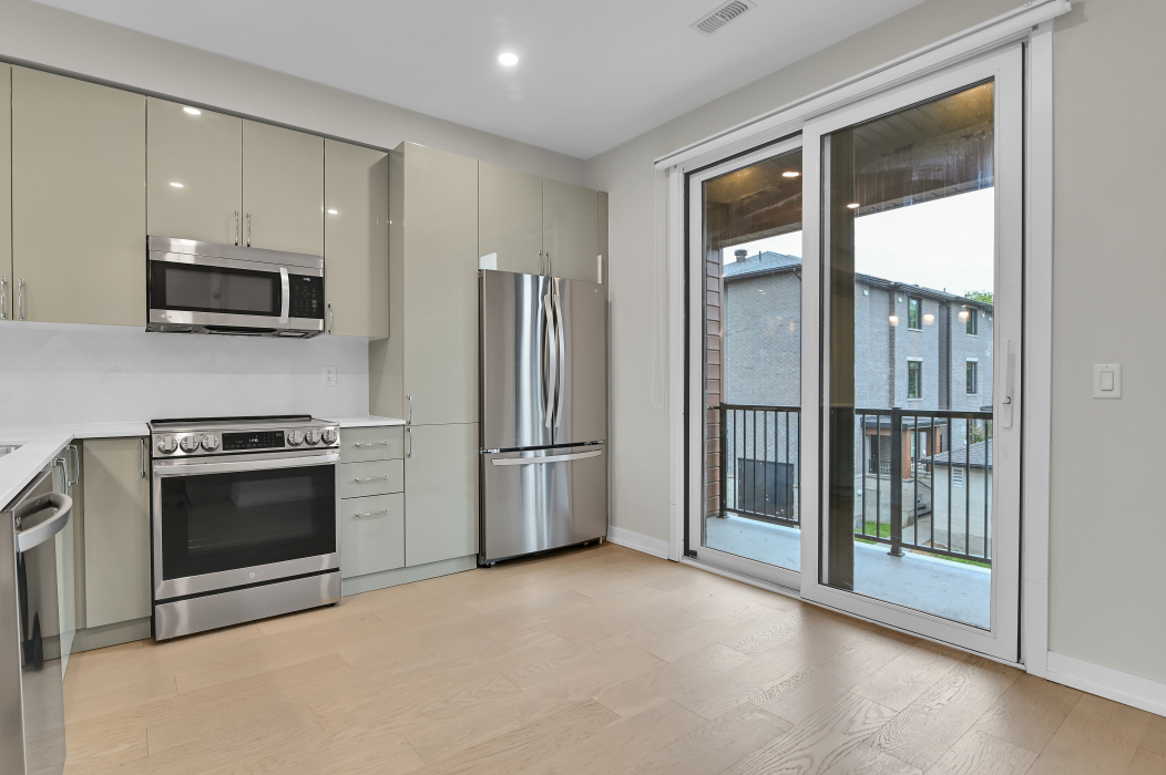 Kitchen with balcony access in the 2-bedroom Kanata rental.