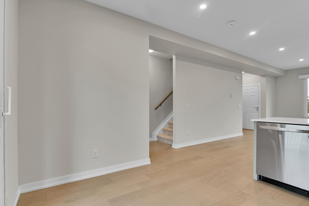 Interior stairs connecting levels in the 2-bedroom townhouse.