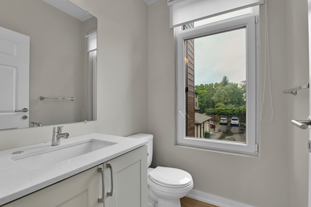 Half bathroom conveniently located in the 2-bedroom townhouse.