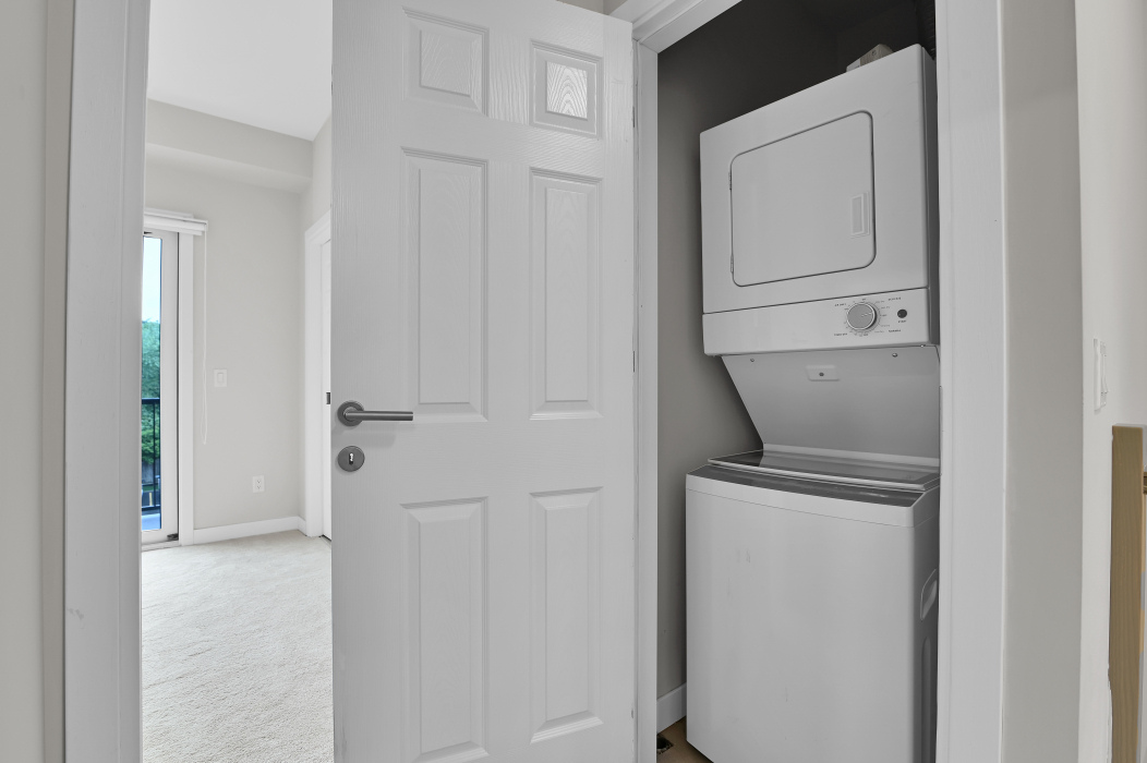 Laundry area with washer and dryer hookups in the townhouse.