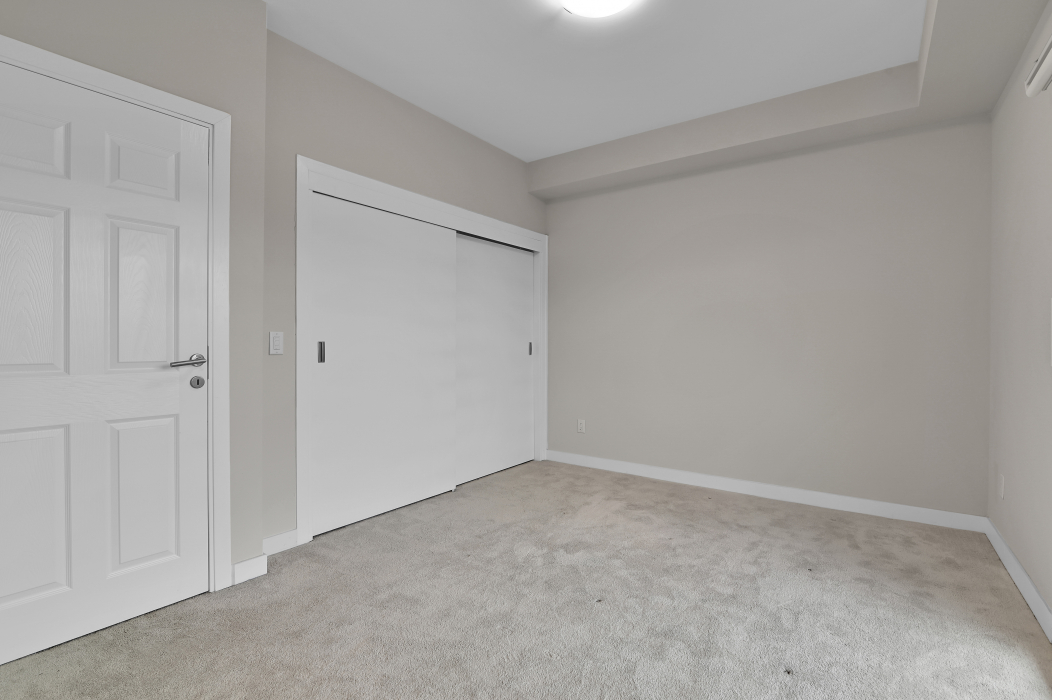 Walk-in closet in the master bedroom of the 2-bedroom townhouse.