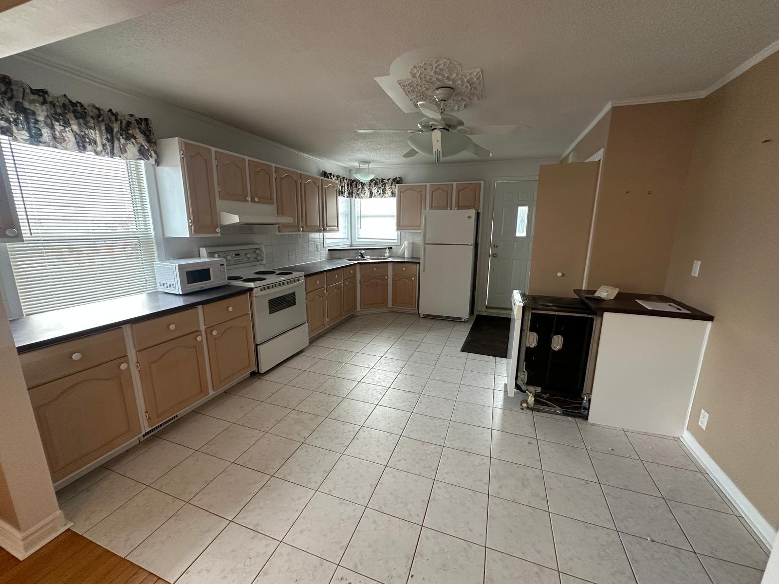 Modern kitchen with ample cabinet space in a 2-bedroom Orleans apartment.